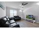 Comfortable living room with leather sofas and a large flat screen TV at 709 Centervale Dr, Celebration, FL 34747