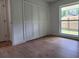 Spacious bedroom with wood-look floors and a large closet at 802 Lindenwald Ln, Altamonte Springs, FL 32701