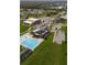 Resort-style community aerial view showcasing the clubhouse, pool, and lush landscaping at 827 Albi Ct, Kissimmee, FL 34759