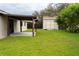 Backyard with covered patio and storage shed at 827 Albi Ct, Kissimmee, FL 34759