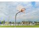Outdoor basketball court view with pool and playground in the background at 827 Albi Ct, Kissimmee, FL 34759