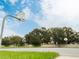 Outdoor basketball court with well maintained netting and lush green surroundings at 827 Albi Ct, Kissimmee, FL 34759