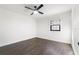 Bright bedroom featuring hardwood floors, a modern ceiling fan, and a window at 827 Albi Ct, Kissimmee, FL 34759