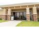 Building entryway featuring stone columns and double doors at 827 Albi Ct, Kissimmee, FL 34759