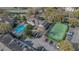 Aerial view showing community pool, tennis court, and parking at 8301 Elm Park Dr # 634, Orlando, FL 32821