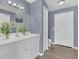 Clean bathroom with double vanity, white cabinets, and a toilet at 8301 Elm Park Dr # 634, Orlando, FL 32821