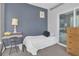 Small bedroom with a single bed, desk and chair at 8301 Elm Park Dr # 634, Orlando, FL 32821
