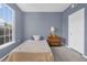 Charming bedroom with window, bed, and wooden dresser at 8301 Elm Park Dr # 634, Orlando, FL 32821