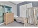 Bedroom with single bed, dresser, and access to a patio at 8301 Elm Park Dr # 634, Orlando, FL 32821