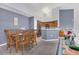 Dining room with wood table and chairs, adjacent to kitchen at 8301 Elm Park Dr # 634, Orlando, FL 32821