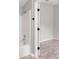 Clean bathroom with a white bathtub and shower at 937 Elkcam Blvd, Deltona, FL 32725