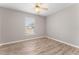 Spacious bedroom with ceiling fan and wood-look flooring at 937 Elkcam Blvd, Deltona, FL 32725
