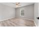 Well-lit bedroom with ceiling fan and wood-look flooring at 937 Elkcam Blvd, Deltona, FL 32725