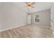 Bright bedroom with ceiling fan and wood-look flooring at 937 Elkcam Blvd, Deltona, FL 32725