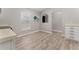 Kitchen dining area with light gray walls and wood-look vinyl flooring at 937 Elkcam Blvd, Deltona, FL 32725