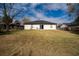 Back exterior view of a single story home at 937 Elkcam Blvd, Deltona, FL 32725