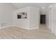 Bright living room with kitchen passthrough and luxury vinyl plank flooring at 937 Elkcam Blvd, Deltona, FL 32725