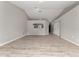 Open concept living room with gray walls and wood-look vinyl flooring at 937 Elkcam Blvd, Deltona, FL 32725