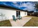 Concrete patio with two green chairs at 937 Elkcam Blvd, Deltona, FL 32725