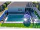 Inviting pool and patio, fenced backyard at 9850 Hidden Dunes Ln, Orlando, FL 32832
