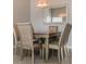 Elegant dining room with a table and six chairs at 9850 Hidden Dunes Ln, Orlando, FL 32832