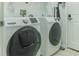 Bright laundry room with Samsung washer and dryer at 9850 Hidden Dunes Ln, Orlando, FL 32832