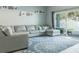 Spacious living room featuring a large sectional sofa and sliding glass doors at 9850 Hidden Dunes Ln, Orlando, FL 32832