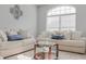 Bright living room with two sofas and a coffee table at 9850 Hidden Dunes Ln, Orlando, FL 32832