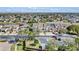 Aerial view of townhouses and lake at 1009 Wood Cv, Kissimmee, FL 34743