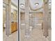 Spa-like bathroom with a soaking tub, walk-in shower, and dual vanities at 1009 Wood Cv, Kissimmee, FL 34743