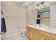 Bathroom with double vanity and a shower/tub combo at 1009 Wood Cv, Kissimmee, FL 34743