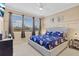 Bright bedroom with large windows, plush bed, and ample natural light at 1009 Wood Cv, Kissimmee, FL 34743