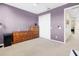 Purple bedroom with double dresser and closet at 1009 Wood Cv, Kissimmee, FL 34743