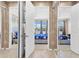 Elegant hallway with mirrored closets and access to bedrooms at 1009 Wood Cv, Kissimmee, FL 34743