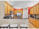 Spacious kitchen with light wood cabinets and granite countertops at 1009 Wood Cv, Kissimmee, FL 34743