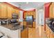 Kitchen boasts stainless steel appliances and wood cabinets at 1009 Wood Cv, Kissimmee, FL 34743