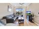 Comfortable living area featuring hardwood floors and patio access at 1009 Wood Cv, Kissimmee, FL 34743
