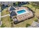 Community pool with surrounding patio and lounge chairs at 1009 Wood Cv, Kissimmee, FL 34743