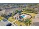 Community pool with lounge chairs and gated access at 1009 Wood Cv, Kissimmee, FL 34743