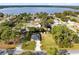 Breathtaking aerial view showcasing a charming lakeside community with lush greenery and serene water views at 1150 Eden Dr, St Cloud, FL 34771