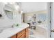 Bright bathroom with double sinks, soaking tub, and neutral color scheme at 1150 Eden Dr, St Cloud, FL 34771