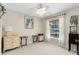 Bright bedroom with a large window, ceiling fan, neutral walls, and ample space for comfortable living at 1150 Eden Dr, St Cloud, FL 34771