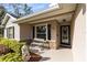 Inviting front porch with bench seating and decorative lion statue at 1150 Eden Dr, St Cloud, FL 34771