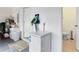 Well-lit garage featuring ample storage, cleaning supplies, and a convenient half bathroom at 1150 Eden Dr, St Cloud, FL 34771