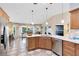 Spacious kitchen with modern appliances, sleek countertops, and a view of the dining area at 1150 Eden Dr, St Cloud, FL 34771