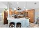 Bright kitchen with modern lighting, a breakfast bar, stainless steel appliances, and ample cabinet space at 1150 Eden Dr, St Cloud, FL 34771