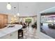 Open kitchen and dining area with views of the screened lanai and pool at 1150 Eden Dr, St Cloud, FL 34771