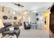 Comfortable living room with elegant decor, neutral walls, and a ceiling fan, perfect for relaxation and gatherings at 1150 Eden Dr, St Cloud, FL 34771