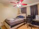 Bedroom featuring a white wooden bed frame, a large desk, and neutral-colored walls at 123 Lakeview Dr, Auburndale, FL 33823