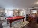 Game room featuring a pool table, a bar area, built in shelves, and dark wood flooring at 123 Lakeview Dr, Auburndale, FL 33823